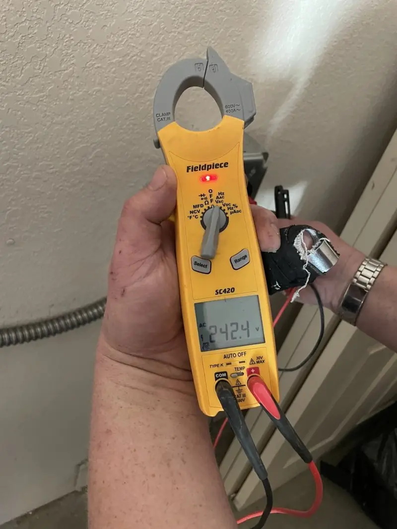 Voltage testing with clamp meter during Hot Tub / Pool Electrical Wiring in Fairview